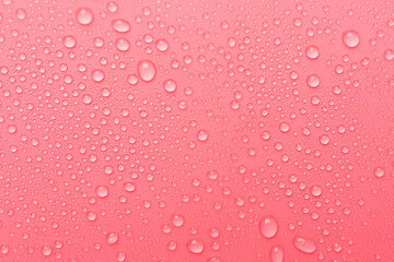 Water drops on color background, top view