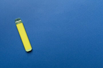 Disposable electronic cigarettes on color background, top view