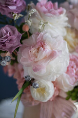 Beautiful flowers. Preserved roses with dried flowers bouquet closeup. Beautiful flower arrangement in a pink box.