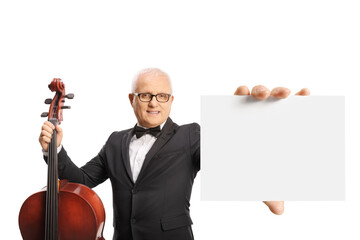 Elegant man with cello holding a blank cardboard