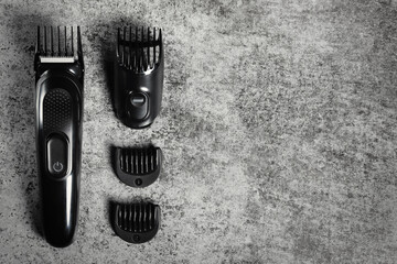 Electric shave machine with attachments. Electric shaver top view with copy space.