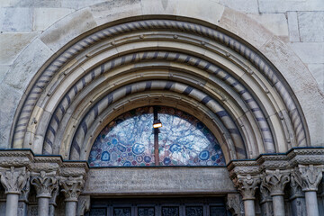 Main entrance of famous protestant church Great Minster at the old town of Zürich on a cloudy autumn day. Photo taken November 4th, 2022, Zurich, Switzerland.