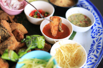 selective focus of fried fish salad with Thai herb for healthy eating in dailiy life.