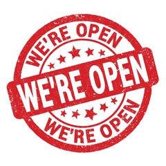 WE'RE OPEN text written on red round stamp sign.