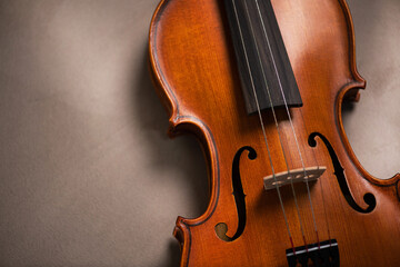 Fototapeta na wymiar Old reto violin on a vntage brown color texture.