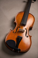Fototapeta na wymiar Old reto violin on a vntage brown color texture.