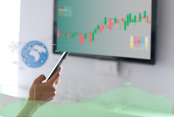 hand use phone for investing in stock market and analysis on screen