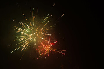 yellow-green-red firework at black background