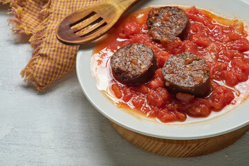 Spanish blood sausage with tomato