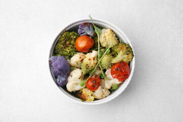 Delicious salad with cauliflower and tomato on white table, top view