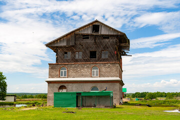 Quirky house. Unusual strange unfinished house in the countryside.