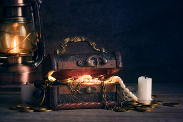 trunk with wealth, open vintage wooden treasure chest, concept of pirate treasure, wealth, greed