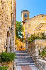 Fototapeta na wymiar Our Lady Assumption church, Notre Dame de l’Assomption in historic old town of Eze rising over French Riviera Coast of Mediterranean Sea in France