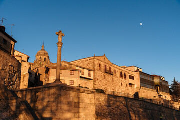 Fototapeta na wymiar Cityscape of the old town of Salamanca. Castilla Leon, Spain. Low angle view against blue sky