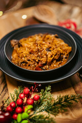 Homemade sauerkraut stew with mushrooms. Traditional Polish bigos. - obrazy, fototapety, plakaty