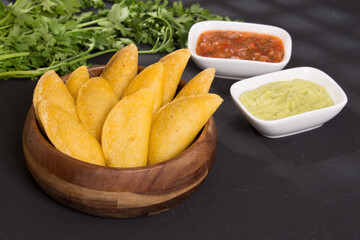 Colombian empanada - on the black background.traditional colombian food