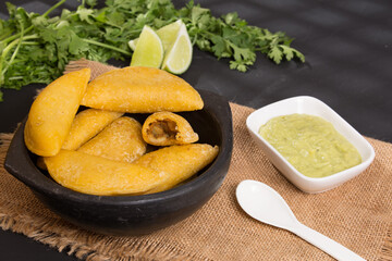 Colombian empanada - on the black background.traditional colombian food