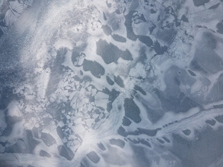 aerial top down view of frozen lake surface and texture