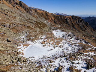 Fototapeta na wymiar drone aerial view of mountain frozen lakes in the Alps