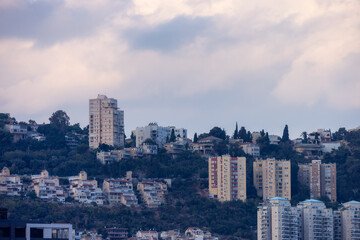 Fototapeta na wymiar Homes and Buildings in a modern city, Haifa, Israel. Cityscape background.