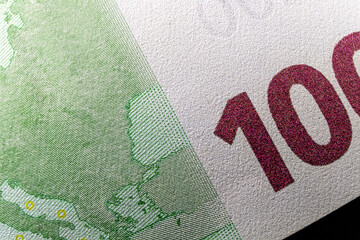 Macro, number 100, and copyspace of hundred euro banknote. - 558182571