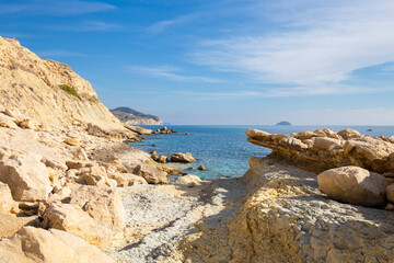 Fototapeta na wymiar Close-up on rocks, bays, clear sea - natural background, Spain, Costa Blanca