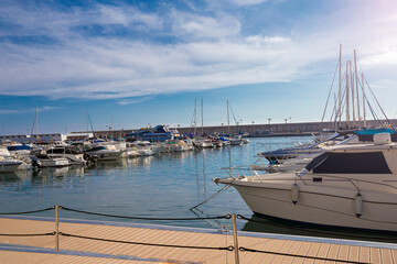 Fototapeta premium Mediterranean sea coast in the resort town overlooking the promenade and harbor with yachts, province of Alicante,Villa Hoyosa, Costa Blanca, Spain