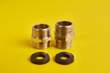 Double nipples with an external thread for connecting pipeline elements and rubber gaskets. Plumbing and heating.