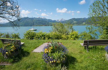 recreational place tourist resort Tegernsee with benches. bavarian spring landscape