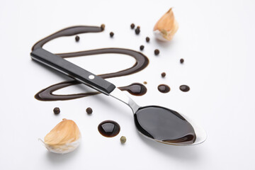 Organic balsamic vinegar and cooking ingredients on white background