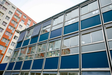 Facade of administrative building, made in the 70s with modular panels containing asbestos