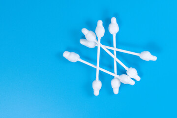ear sticks on a blue background, top view