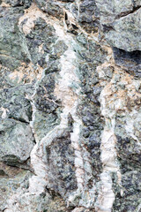 Detail of asbestos vein sinuosity in its natural geological environment and asbestos fibers, mix of chrysotile and tremolite, Queyras, French Alps