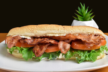 bacon lettuce  and tomato  in a sub  sandwich