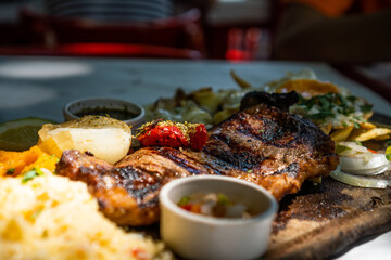 piece of meat cooked on a wooden board
