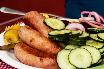 Plate with meal consisting of sausage and salad