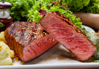 sliced grilled steak served , Picanha