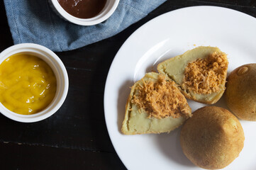 Coxinha cut in half showing chicken stuffing