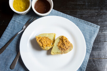 Chicken drumstick cut in half inside a plate