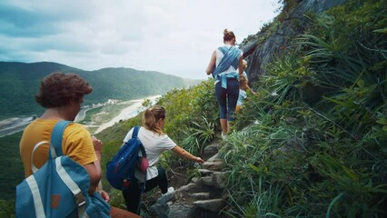 Family hiking the rocky trail. Extended family with kids explore the trail and hike on the slope with rocks - Powered by Adobe