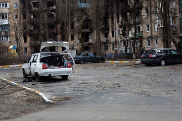 Buildings and cars damaged by Russian bombs.