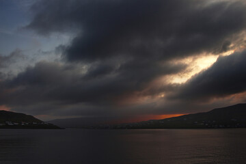 Fototapeta na wymiar Fjord at night with storm clouds