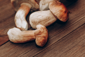Boletus edulis on a table made of brown boards preparation for eating.