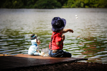 child playing in the lake