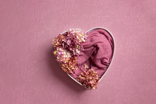 heart made of wood decorated with roses. basket for a photo shoot of newborns. pink rose. heart props for photographers. background for newborns. furniture for dolls
