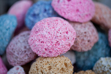 Colored natural pumice stones at the stand on street bazaar in Dahab, Egypt