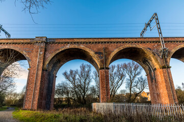 A view looking up at the Corby Viaduct on the outskirts of Corby, Northampton, UK on a bright winters day