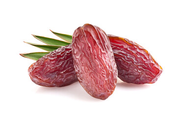 Dates fruit with leaves in closeup on white background