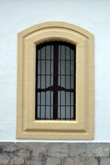 Fototapeta na wymiar The beautiful exterior facade with a wooden door in the historic of Cordoba Spain