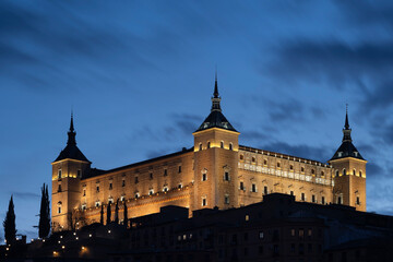 Fototapeta na wymiar Alcazar de Toledo rises into evening twilight, Toledo, Spain